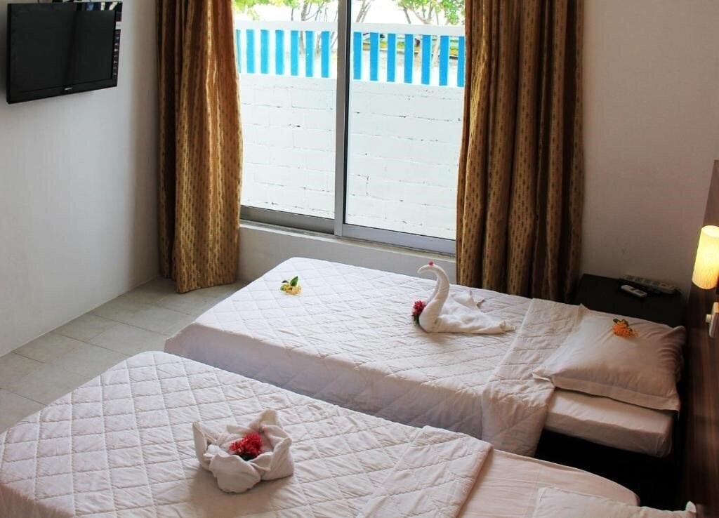 Фотография Rip Tide Vacation Inn Guest House гостиный двор